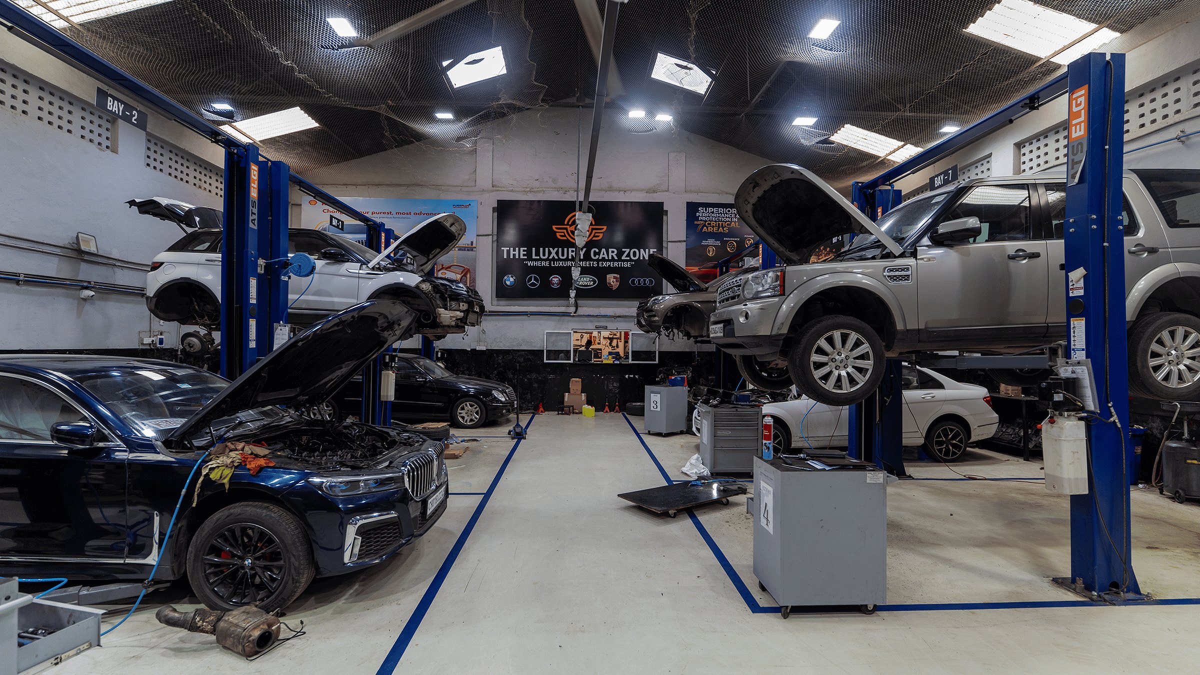 A TLCZ specialist finishing a luxury vehicle