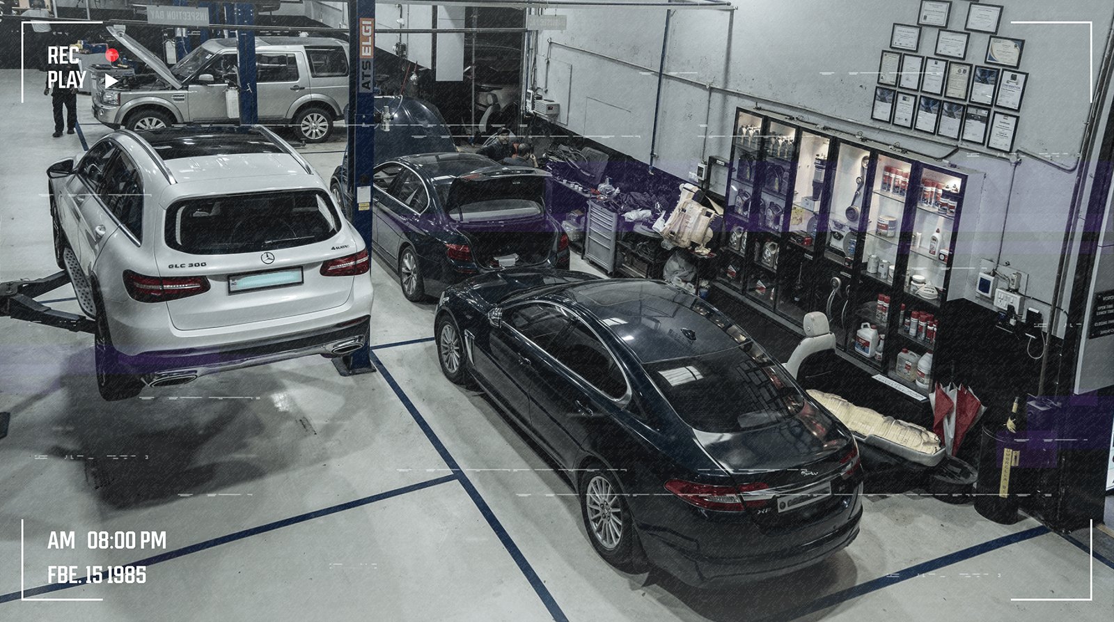 Live CCTV feed of a BMW on the lift in Service Bay 3