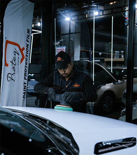 A freshly detailed SUV under studio lights